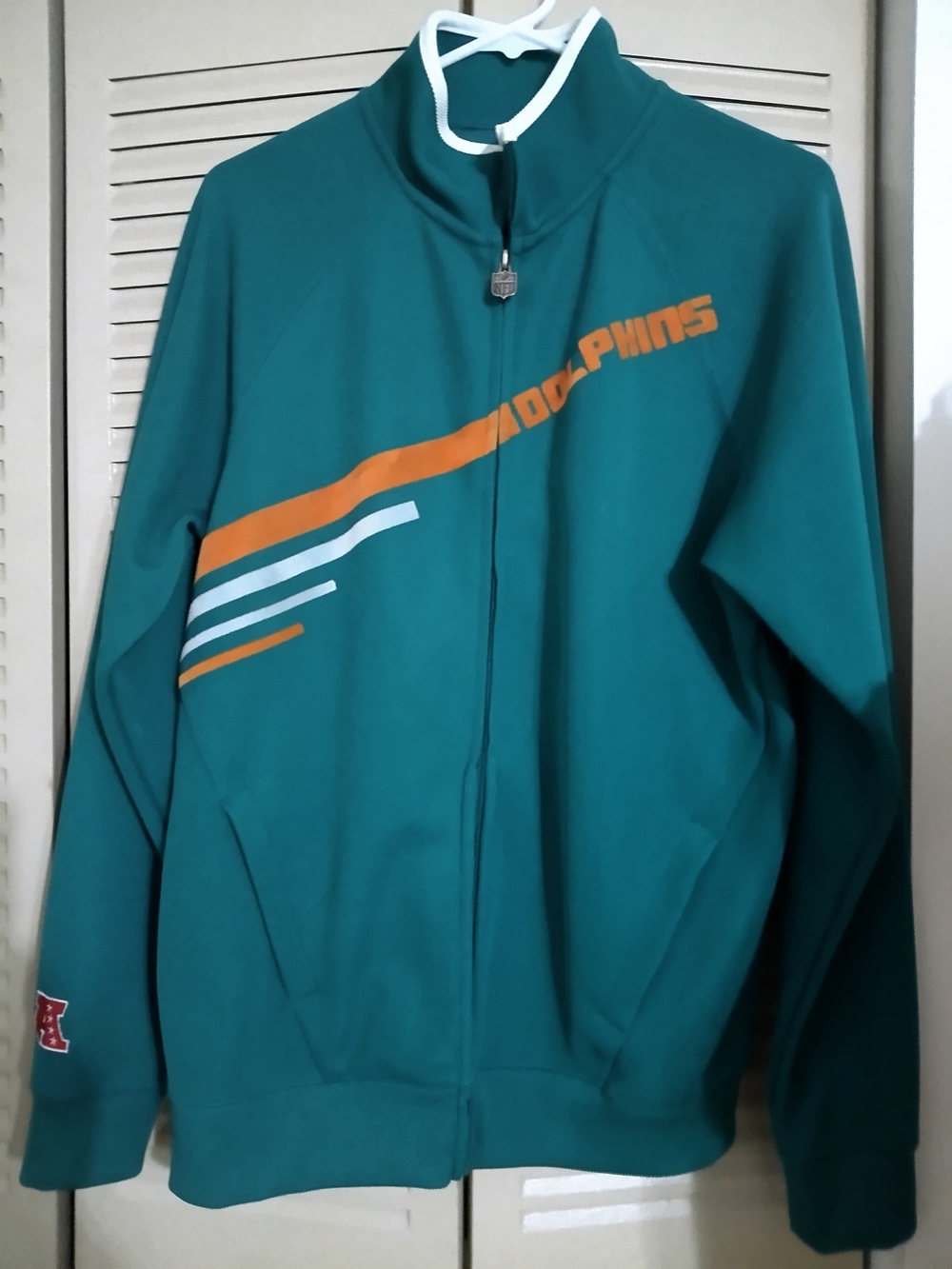 NFL Teal and Black Team Jacket with Red and Blue Logo